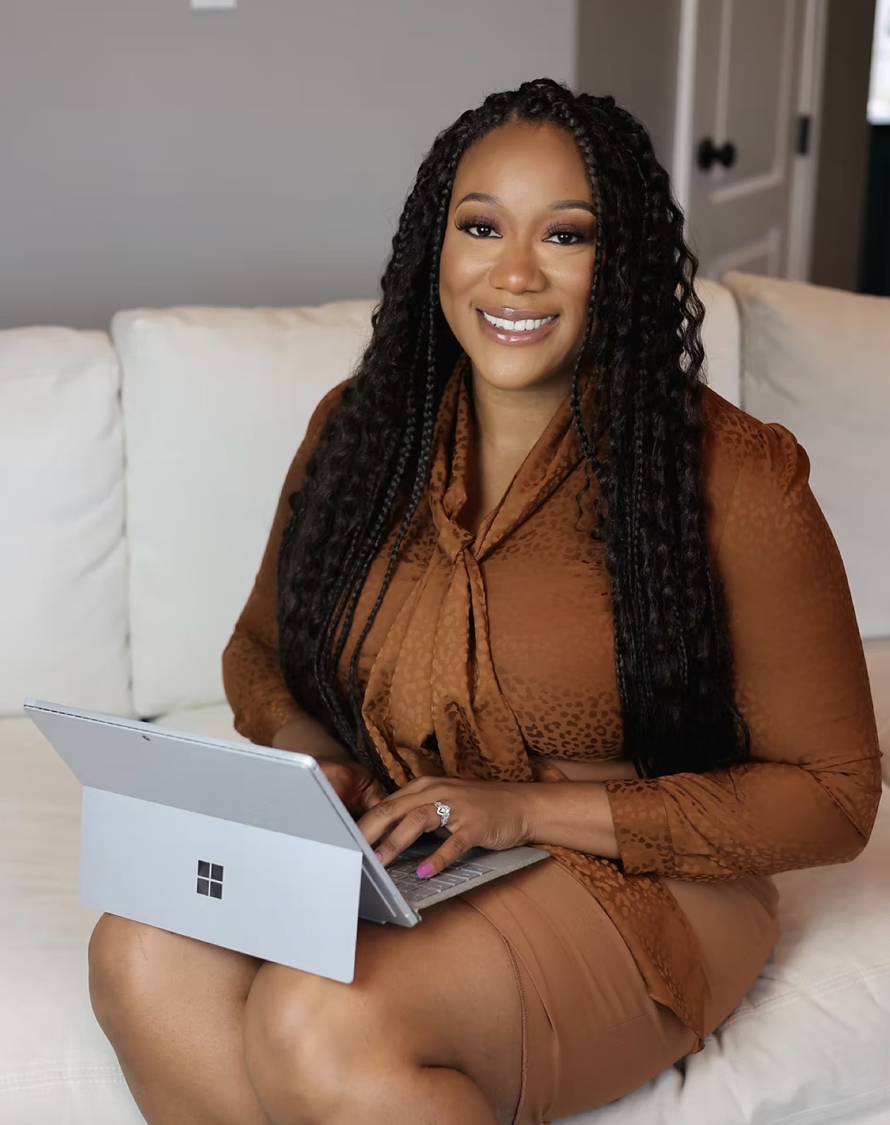 Michelle Bidwell, founder of Granted Advisors, working on her laptop at home